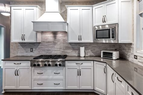 steel gray counter white cabinet|dark gray backsplash white cabinets.